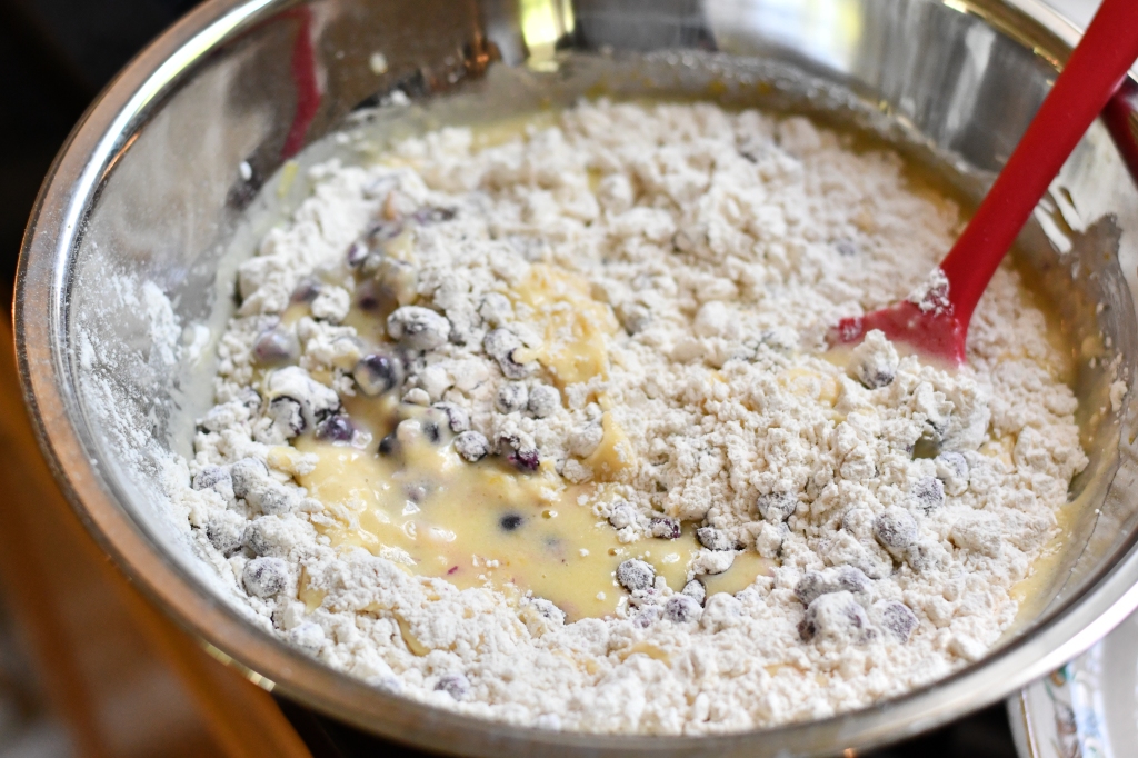Mixing lemon blueberry cake ingredients